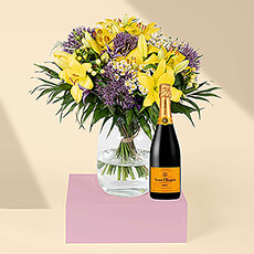 Is there anything more uplifting than bright yellow flowers? Yes - yellow flowers with sparkling Veuve Clicquot yellow label Champagne!