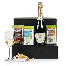 Make any day a celebration with a bottle of Raza Fair Trade Torrontés Brut sparkling wine from Argentina. Paired with Ethiquable dark chocolate truffles and crunchy Fair Trade cashews, this Trias gift set is elegant, stylish, and ethical.
