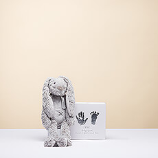 Welcome a new baby with this special newborn gift featuring a lovable plush bear for baby and a hand & footprint kit for parents to capture precious memories. An ideal newborn gift for a boy or a girl.