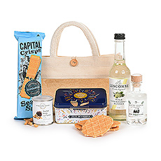 Take your Apero anywhere with this handy ecological tote bag fill with delicious Jules Destrooper butter crisp cookies in a festive tin, gourmet truffle peanuts, and sea salt Capital Crisps, Belgian gin, and an elderflower soft drink.