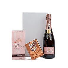 Surprise her with this uplifting pink gift featuring Bottega Rose Gold Pinot Noir Sparkling Rosé, Fossier Sable Rose Biscuits Framboise, and luxury Neuhaus Belgian chocolates.