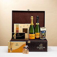 Some occasions call for a truly spectacular gift. When you need a VIP gift that makes a grand impression, this luxurious Godiva chocolate and Veuve Clicquot Champagne gift is the perfect selection. Boasting not one, but two bottles of the sought-after Champagne, the gift includes both classic Veuve Clicquot Brut and exquisite Veuve Clicquot 2015 Vintage.
