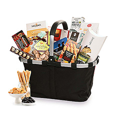 This spectacular gourmet gift bag makes an impressive statement of your generosity and esteem for corporate gifts, Christmas, weddings, birthdays, and other important occasions. A black Reisenthel Carry Bag overflows with the finest European sweets and savories.