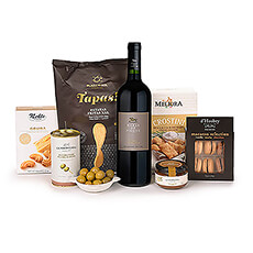 The ultimate gourmet gift box to surprise someone dear with a Château des Tourtes red wine and exquisite gourmet foods. This delicious snack gift basket is filled with crunchy crisps, Gouda cheese biscuits, Italian seasalt and rosemary crackers, savoury green olive tapenade, anchovy-stuffed olives and as a sweet treat some fine selection of macaroons.