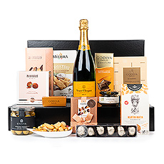Presenting one of our most exquisite gifts: the Ultimate Gourmet with legendary Veuve Clicquot Brut Champagne. The superb Champagne is paired with a carefully curated selection of the finest European gourmet specialties and luxury Belgian chocolates.