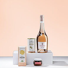 Send the simple pleasures of light aperitifs to enjoy with a crisp rosé wine on a summer evening. This delightful summer wine gift features a beautiful French rosé paired with European gourmet tapenade rouge, artisan dill crackers, and Manzanilla olives with anchovies.