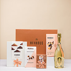 Presenting a beautiful gift with luxury Neuhaus Belgian chocolates and Bottega Zero non-alcoholic sparkling wine.
