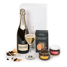 Champagne gift delivery to Germany and other parts of Europe is a wonderful way to send your regards. Our elegant Champagne gift basket features a bottle of French Champagne Lenoble Grand Cru Blancs de Blancs and savory gourmet snacks to create an impressive corporate gift basket.
