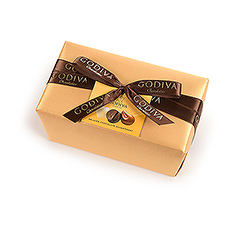 The classic and elegant Belgian ballotin wrapped in luxurious gold paper with a hand-tied ribbon contains a rich assortment of Godiva premium chocolates.
