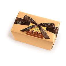 The classic and elegant Belgian ballotin wrapped in luxurious gold paper with a hand-tied ribbon contains a rich assortment of Godiva premium chocolates.