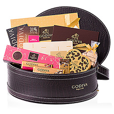 The ultimate gift for true connoisseurs of Godiva chocolate. A luxurious, leather gift basket is filled with a rich assortment of the finest Belgian chocolate that every Godiva fan dreams of: pralines, truffles, biscuits, chocolate bars and tablets, and so much more.