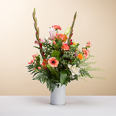 Make a splash with this brilliant bouquet with a gorgeous array of colors and a rich variety of textures. Our in-house florists hand-select each fresh blossom for this colorful floral arrangement. Shades of purple, pink, orange, red, and white make a grand statement to enhance any space.