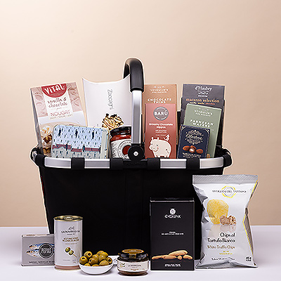 This spectacular gourmet gift bag makes an impressive statement of your generosity and esteem for corporate gifts, Christmas, weddings, birthdays, and other important occasions. A black Reisenthel Carry Bag overflows with the finest European sweets and savories.