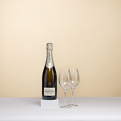 A sparkling bottle of Champagne Lenoble Blanc de Blancs is presented in a luxury black gift box with a pair of signature glasses. Lenoble Champagne Grand Cru Blanc de Blancs is the 2010 winner of the prestigous Concours De Bruxelles.