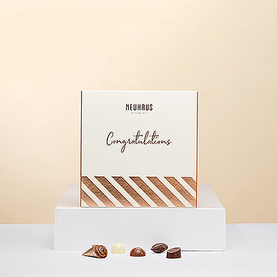 La meilleure façon de féliciter quelqu'un est de lui offrir un cadeau gourmand. Ce coffret Découverte Félicitations du maître chocolatier belge Neuhaus est le cadeau idéal pour tout amateur de chocolat.