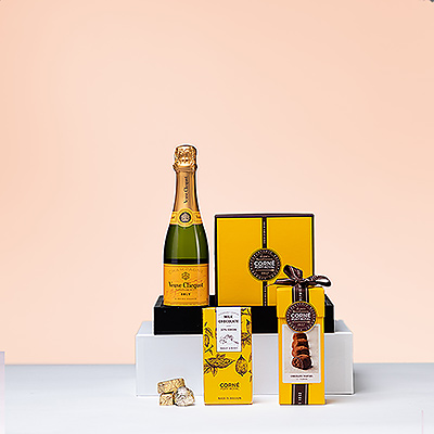 What could be better than the timeless pairing of luxury Champagne with delicious Belgian chocolate? Presented in a chic black tray, this gift features world-famous Veuve Clicquot with a rich assortment of Corné Port-Royal truffles, assorted chocolates, and a generous chocolate tablet.