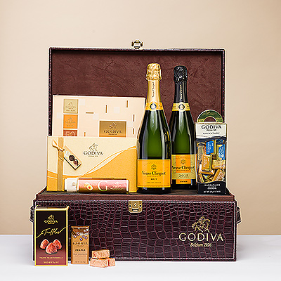 Some occasions call for a truly spectacular gift. When you need a VIP gift that makes a grand impression, this luxurious Godiva chocolate and Veuve Clicquot Champagne gift is the perfect selection. Boasting not one, but two bottles of the sought-after Champagne, the gift includes both classic Veuve Clicquot Brut and exquisite Veuve Clicquot 2015 Vintage.