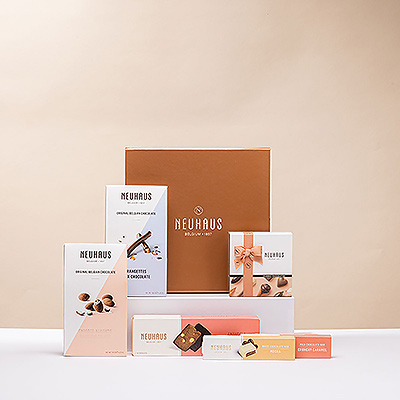 Surprenez quelqu'un de spécial avec ce coffret cadeau en bronze rempli de chocolat belge de haute qualité du maître chocolatier Neuhaus. Ce cadeau au chocolat belge présente une grande variété de délices chocolatés pour satisfaire tous les goûts.