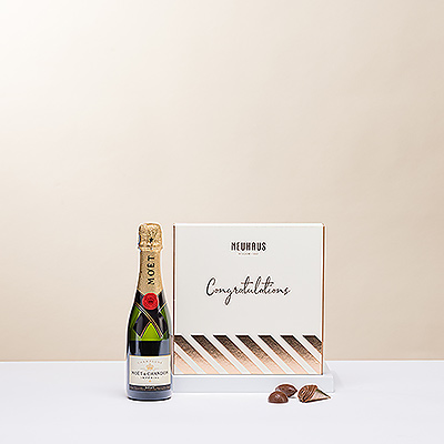 El clásico maridaje de champán y bombones belgas es la forma perfecta de enviar sus felicitaciones para celebrar los logros de la vida. Todos apreciarán el lujoso Champagne Moët Imperial con deliciosos chocolates belgas Neuhaus en una caja de regalo especial "Felicidades".