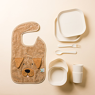 Dinnertime will be healthy, happy, and fun with this Mushie dinner set and Mr. Dog bib by Trixie. It is a great baby shower or newborn gift idea.