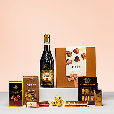 The pleasures of ruby red Italian wine and premium Belgian chocolates and other sweets are combined in this stylish gift. Dezzani 'Appassimento' Rosso wine is wonderful to sip with luxury Neuhaus Belgian chocolate pralines, Godiva truffles, chocolate bars, and cappuccino Pearls, rich macarons, and more.
