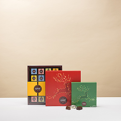 Wünschen Sie ihnen ein frohes Weihnachtsfest mit einem Turm aus köstlicher Corné Port-Royal Schokolade! Die diesjährigen Corné Port-Royal Weihnachtsgeschenkschachteln zeigen ein springendes Rentier mit bunten Weihnachtslichtern.