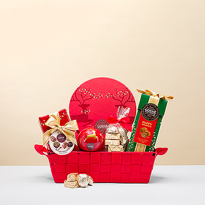 Nada mejor para felicitar la Navidad que el chocolate belga. Obsequie a alguien especial con una irresistible colección de bombones navideños Corné Port-Royal en una festiva cesta de regalo roja.