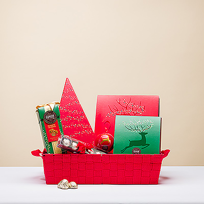 Haga que sea una Navidad dulce y feliz con esta deliciosa cesta de regalo de chocolate Corné Port-Royal con mucho para compartir con toda la familia.