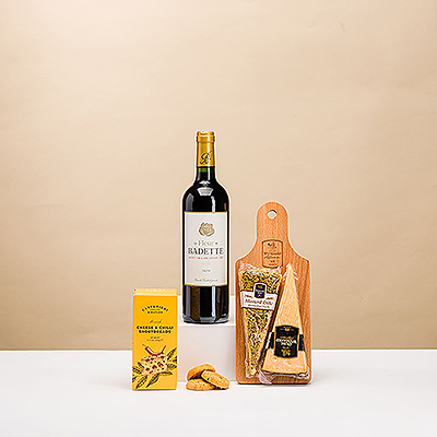 The classic pairing of French red wine and savory Dutch cheese is one of life's timeless pleasures. This gourmet gift presents a duo of Dutch aged and Mosterd cheese on a wooden serving tray with tasty Gouda biscuits.