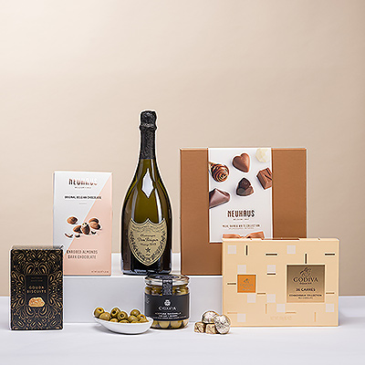 Some gifts truly are the ultimate in luxury, style, and pleasure. This VIP gourmet gift combines the unparalleled elegance of Dom Pérignon Vintage Champagne combined with iconic Neuhaus and Godiva Belgian chocolates and savory Manzanilla olives and Gouda biscuits.