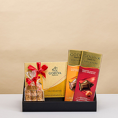 Presenting an elegant Christmas gift for those with impeccable taste: a stylish gift tray with luxurious Godiva chocolates.