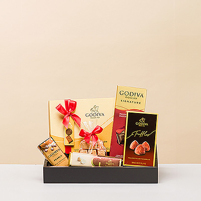 Presenting an elegant gift for those with impeccable taste: a stylish gift tray with luxurious Godiva chocolates and truffles.