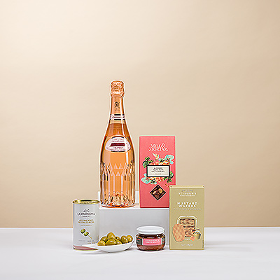 Pretty in pink! Exquisite Vranken Diamant Rosé Brut Champagne in a stunning bottle is presented with a lovely collection of European gourmet snacks in this elegant gift.