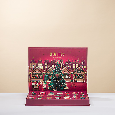 El Calendario de Adviento desplegable Neuhaus es un regalo esencial para cualquier época navideña. Cuente los días que faltan para Navidad mientras se despliega una escena festiva del mercado navideño de la Grand Place de Bruselas.