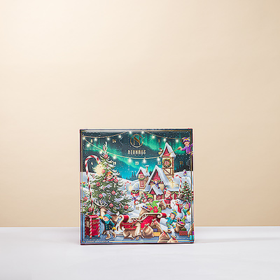 Surprenez petits et grands avec le calendrier de l'Avent Neuhaus Classic. Une charmante scène du Village du Père Noël cache 25 délicieux chocolats belges pour compter les jours jusqu'à Noël d'une manière délicieuse.