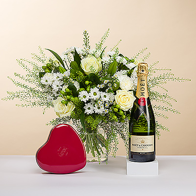 As bright as a twinkling diamond, we present you this stylish bouquet, all in white. The bouquet is accompanied by a festive bottle of Moët & Chandon Champagne and a classic red heart tin filled with Corné Port-Royal Belgian chocolates. It's the perfect gift for any romantic occasion.