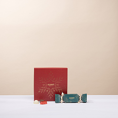 Send delicious Christmas wishes with the perfect pairing of a Neuhaus snowflake gift box and a Christmas cracker.