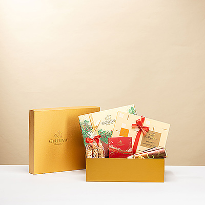 Envoyez des vœux chaleureux pour les fêtes de fin d'année et souhaitez-leur une bonne année avec un coffret cadeau doré rempli des meilleurs chocolats Godiva.