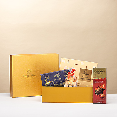 Versenden Sie herzliche Weihnachtsgrüße und wünschen Sie frohe Weihnachten mit einer goldenen Geschenkbox voll mit den besten Godiva-Pralinen.