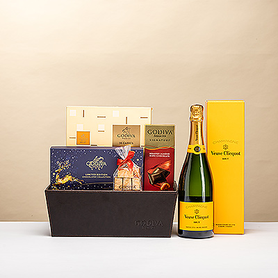 Mímelos estas Navidades con una magnífica cesta de regalo de chocolate Godiva con champán Veuve Clicquot.