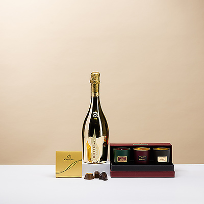 Profitez d'une soirée de Noël confortable à la maison avec de luxueuses bougies parfumées, un mini ballotin Godiva en or de quatre pièces et le pétillant Bottega Gold Prosecco Spumante.
