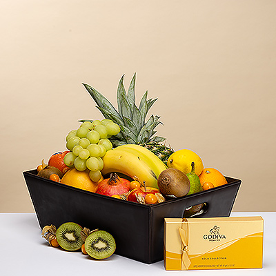 Treat someone to the perfect balance of healthy fruit with a touch of sweet indulgence: 8 delicious Godiva chocolates in an iconic gold gift box. We hand select the freshest exotic and classic fruit of the season and carefully arrange it in a stylish leather style hamper.