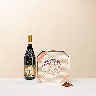 Un elegante regalo imprescindible para los amantes del mejor chocolate belga y el vino tinto.