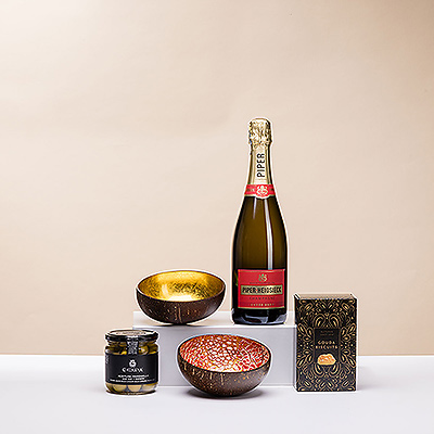 Pop open a festive bottle of Piper-Heidsieck Champagne to enjoy with friends for an elegant apero! The stylish bubbly is presented with equally stylish handmade serving bowls and savory snacks in this apero gift set.