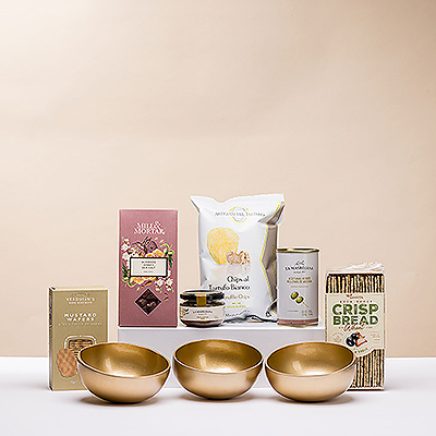 Make hosting effortless with this stylish pairing of savory gourmet snacks and a trio of handmade golden serving bowls. It is a great gift idea for birthdays, thank you gifts, and hostess or housewarming gifts.