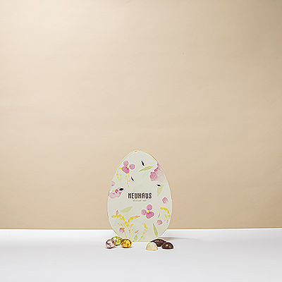 Open the Neuhaus Big Easter Egg to reveal a mouthwatering selection of the finest Neuhaus milk, dark, and white Belgian chocolates and colorful chocolate eggs.