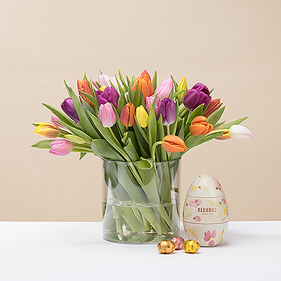 Send springtime cheer with a colorful bouquet of Dutch tulips and a keepsake Neuhaus Metal Easter Egg.