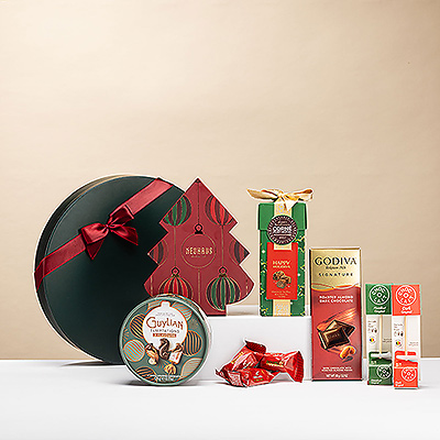 A festive Christmas Chocoholic Deluxe gift box filled with Neuhaus pralines, Corné Port-Royal truffles, Guylian Temptations, Godiva chocolate, Côte d5Or Bouchée, and Mome hot chocolate sticks — the perfect holiday treat for every chocolate lover.