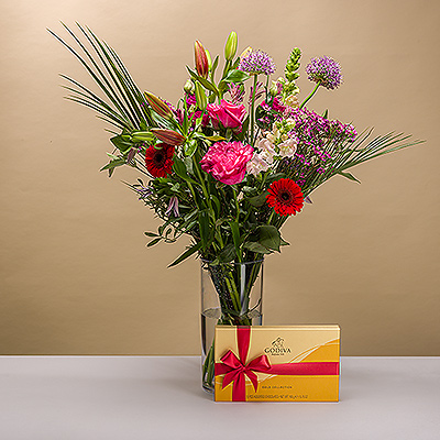 Make a splash this Mother's Day with this brilliant bouquet with a gorgeous array of colors and a rich variety of textures. The stunning bouquet is paired with exquisite Godiva chocolates for the perfect Mother's Day gift!