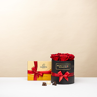 El regalo definitivo para un momento inolvidable. Esta exclusiva caja negra combina la belleza eterna de rosas rojas preservadas con una caja dorada de 15 icónicos bombones Godiva. Un detalle elegante que permanece bello durante años y garantiza una sonrisa inmediata.